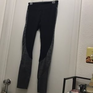 Black and gray compression leggings for running